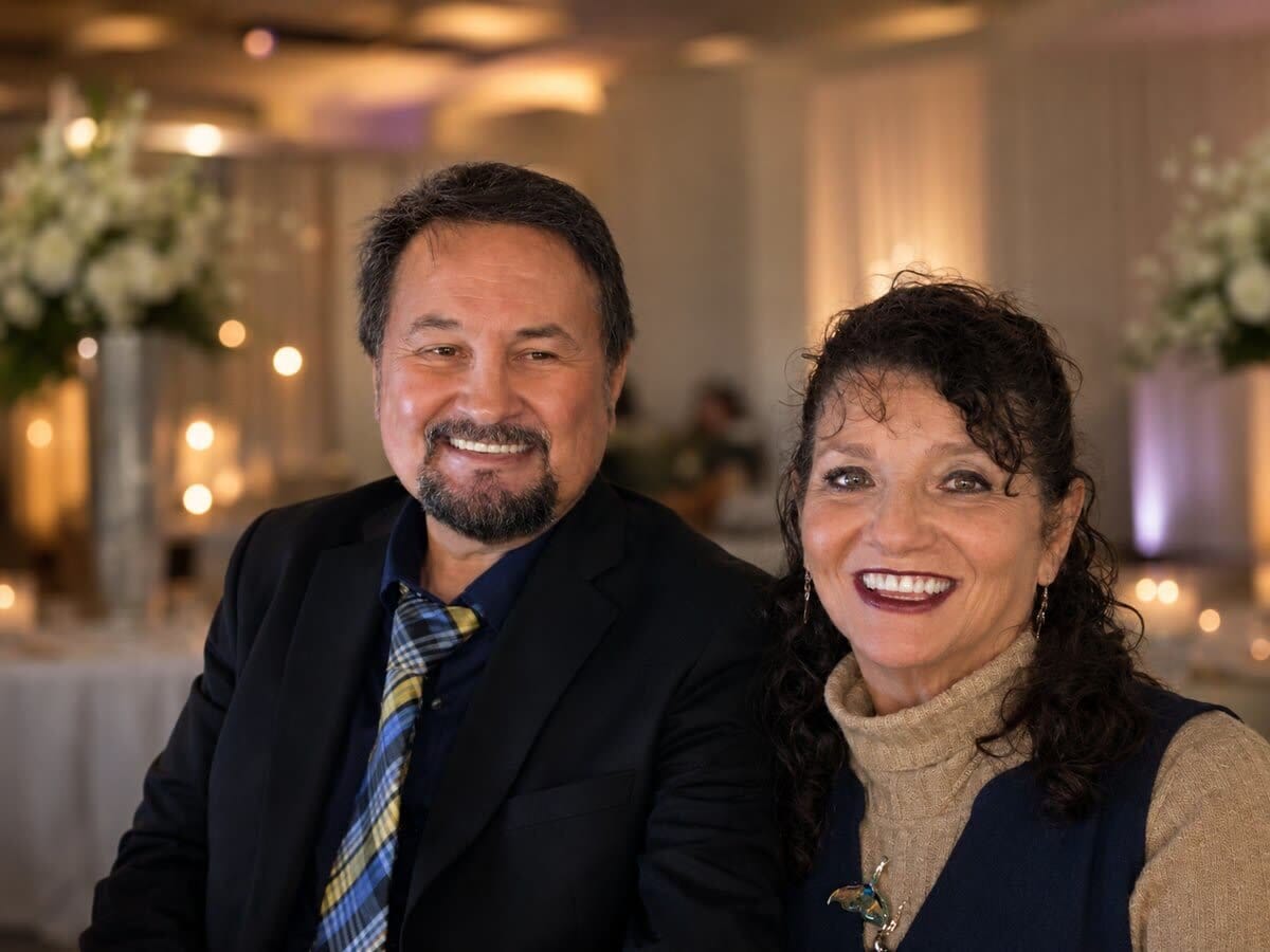 Eddie and Arlene Crunk smiling together at a warmly lit wedding reception at Discovery Lodge in Indiana.